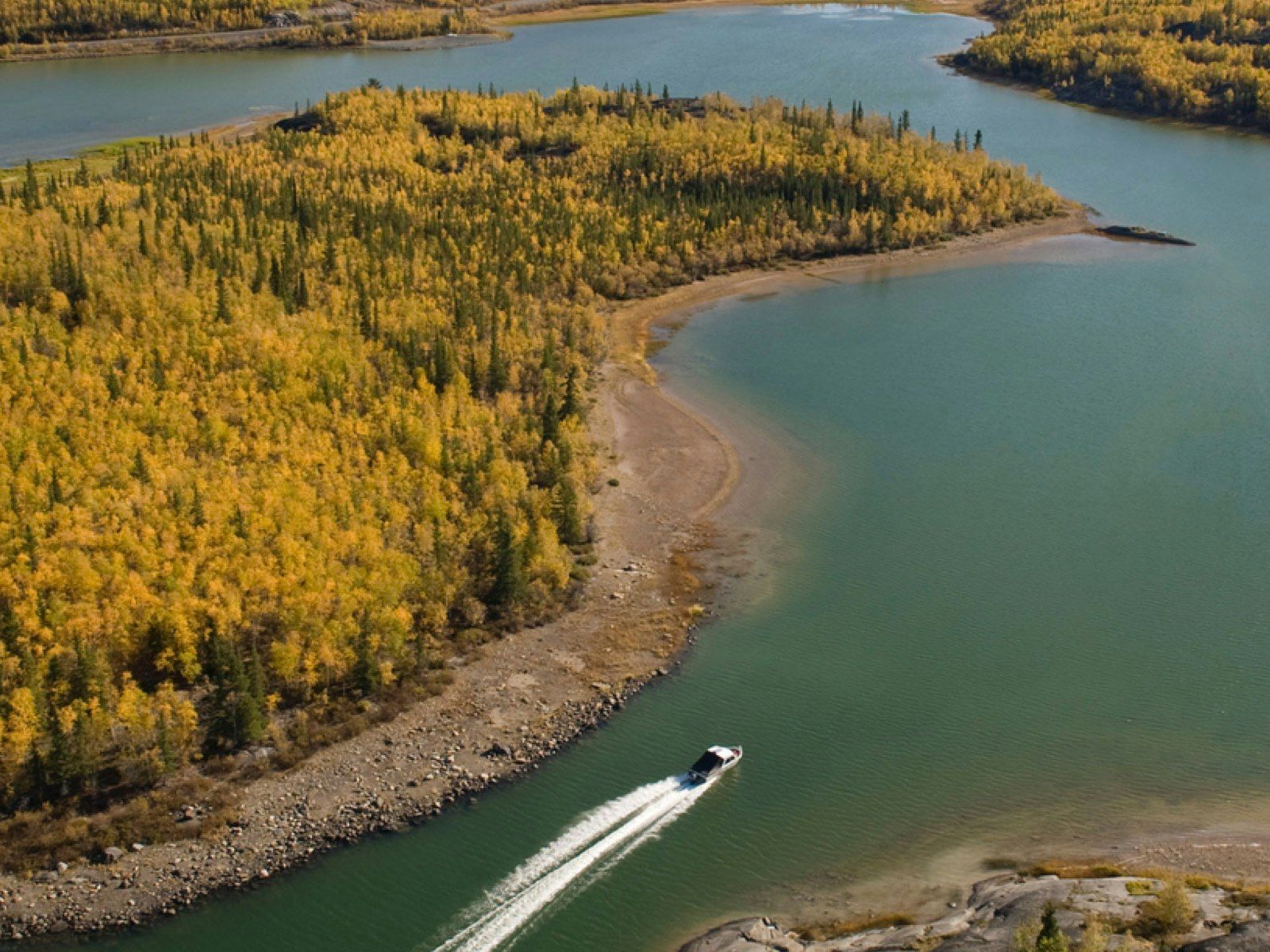 Motorboat driving through a lake 